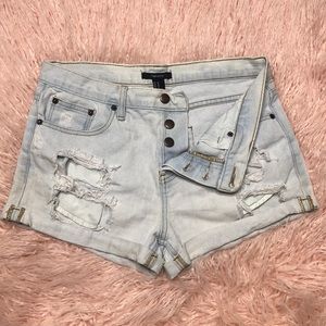 Distressed blue jean shorts.